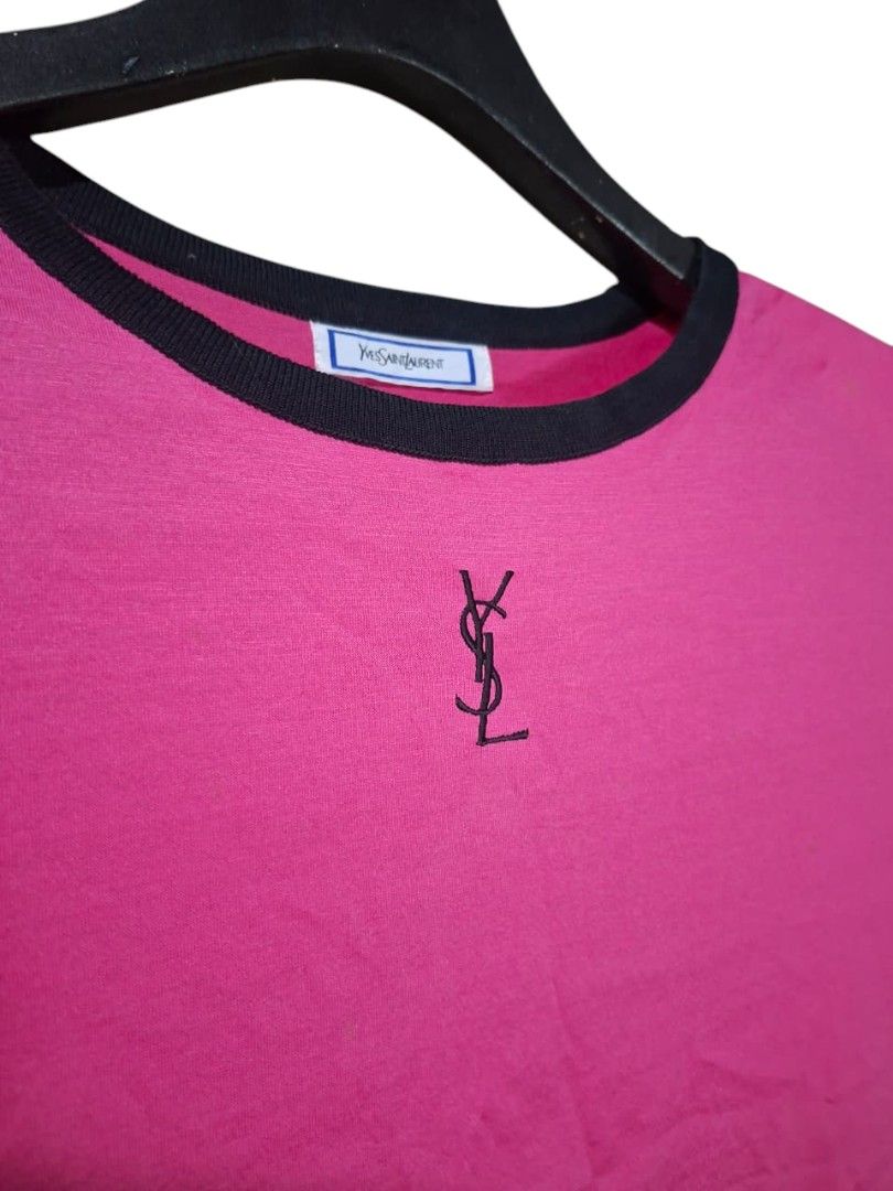 Vintage Yves Saint Laurent Pink Ringer (Category: Shirts) located in Leyte. Submitted by jpsrvd19 (Listing ID 1465296527, Image 2). Description: - Brand: Yves Saint Laurent (YSL) - Color: Vibrant pink with contrast black ribbing - Size: Medium (100% cotton) - Details: Embroidered YSL monogram logo on chest, classic woven neck and care tags - Condition: Soft and comfortable fit - Ideal for: Casual wear or YSL collectors.