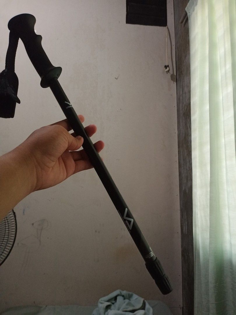 Visionpeaks Antishock System Trekking Pole Hiking Stick (Category: Hiking & Camping) located in Tagum. Submitted by its_yoboii (Listing ID 1465210677, Image 2). Description: - Brand/Model: Visionpeaks trekking pole - Color: Black and green design - Features: Anti-shock system, ergonomic grip handle, and adjustable wrist strap - Mechanism: Twist-lock height adjustment on the shaft - Ideal for: Hiking, camping, and outdoor trail walking.
