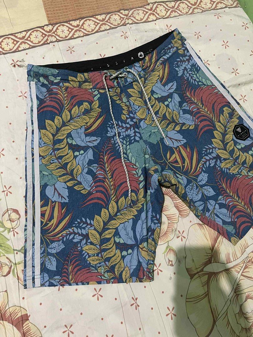 Vissla Floral Board Shorts (Category: Swim Trunks & Board Shorts) located in Calamba. Submitted by summercollectionph (Listing ID 1465315242, Image 3). Description: - Brand: Vissla - Design: Blue tropical leaf and floral print with white side stripes on the left leg - Waistband: Secure drawstring closure - Pocket: Single back pocket with flap closure and branded logo patch - Ideal for: Surfing, swimming, and casual beach days - Size 32 - Length 1