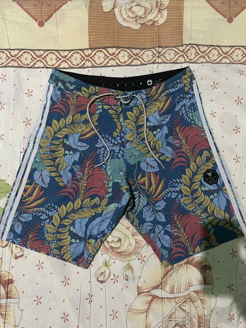 Vissla Floral Board Shorts (Category: Swim Trunks & Board Shorts) located in Calamba. Submitted by summercollectionph (Listing ID 1465315242, Image 1). Description: - Brand: Vissla - Design: Blue tropical leaf and floral print with white side stripes on the left leg - Waistband: Secure drawstring closure - Pocket: Single back pocket with flap closure and branded logo patch - Ideal for: Surfing, swimming, and casual beach days - Size 32 - Length 1