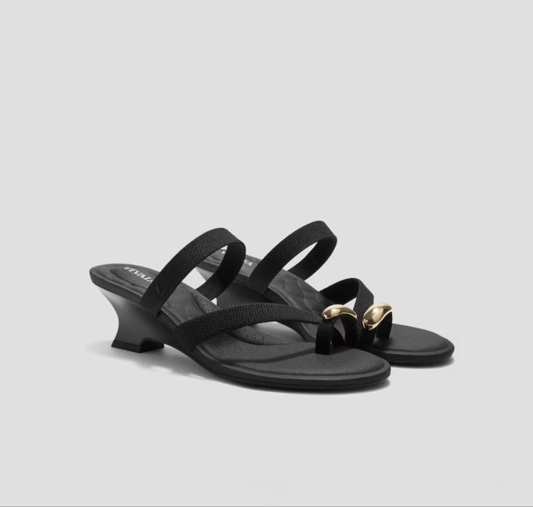 Vivaia Round Toe Ring Sandals (Category: Heels) located in Quezon City. Submitted by mncdc (Listing ID 1465231552, Image 1). Description: - Brand: Vivaia - Color: Black - Style: Slip-on heeled sandals with minimalist design - Details: Two wide fabric straps, thong toe loop, and shiny gold hardware - Heel: Comfortable curved kitten heel - Versatility: Pairs easily with both skirts and trousers Used twice Srp 8k .
