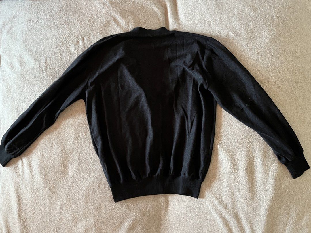 V-Neck Black Button-Down Cardigan for Women (Category: Coats, Jackets and Outerwear) located in Naga. Submitted by kitty_cate02 (Listing ID 1465218497, Image 2). Description: Preloved with minimal signs of usage In good condition - Color: Black - Style: Classic V-neck with front buttons - Fit & Material: Lightweight knit with ribbed hem and cuffs for shape retention - Measurements: Pit-to-pit ~21 inches, Total length ~23 inches - Versatility: Gre