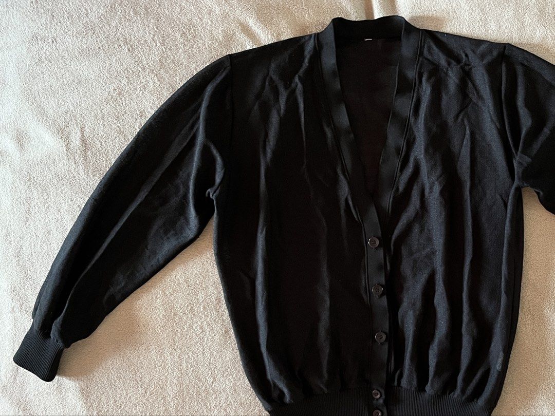 V-Neck Black Button-Down Cardigan for Women (Category: Coats, Jackets and Outerwear) located in Naga. Submitted by kitty_cate02 (Listing ID 1465218497, Image 3). Description: Preloved with minimal signs of usage In good condition - Color: Black - Style: Classic V-neck with front buttons - Fit & Material: Lightweight knit with ribbed hem and cuffs for shape retention - Measurements: Pit-to-pit ~21 inches, Total length ~23 inches - Versatility: Gre