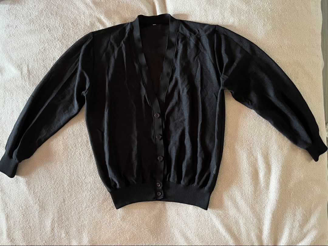 V-Neck Black Button-Down Cardigan for Women (Category: Coats, Jackets and Outerwear) located in Naga. Submitted by kitty_cate02 (Listing ID 1465218497, Image 1). Description: Preloved with minimal signs of usage In good condition - Color: Black - Style: Classic V-neck with front buttons - Fit & Material: Lightweight knit with ribbed hem and cuffs for shape retention - Measurements: Pit-to-pit ~21 inches, Total length ~23 inches - Versatility: Gre