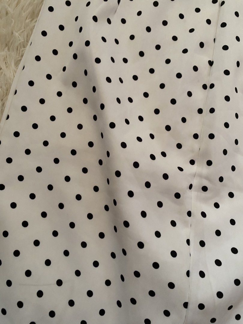 White and Black Polka Dot Skirt (Category: Skirts) located in Guagua. Submitted by zenn_vi (Listing ID 1465273467, Image 2). Description: - Color & Pattern: White with all-over black polka dots - Waistband: Structured with clean stitching and finished edges - Versatility: Easily dresses up for the office or down for weekends - Wardrobe Staple: A classic, timeless piece that matches many tops.