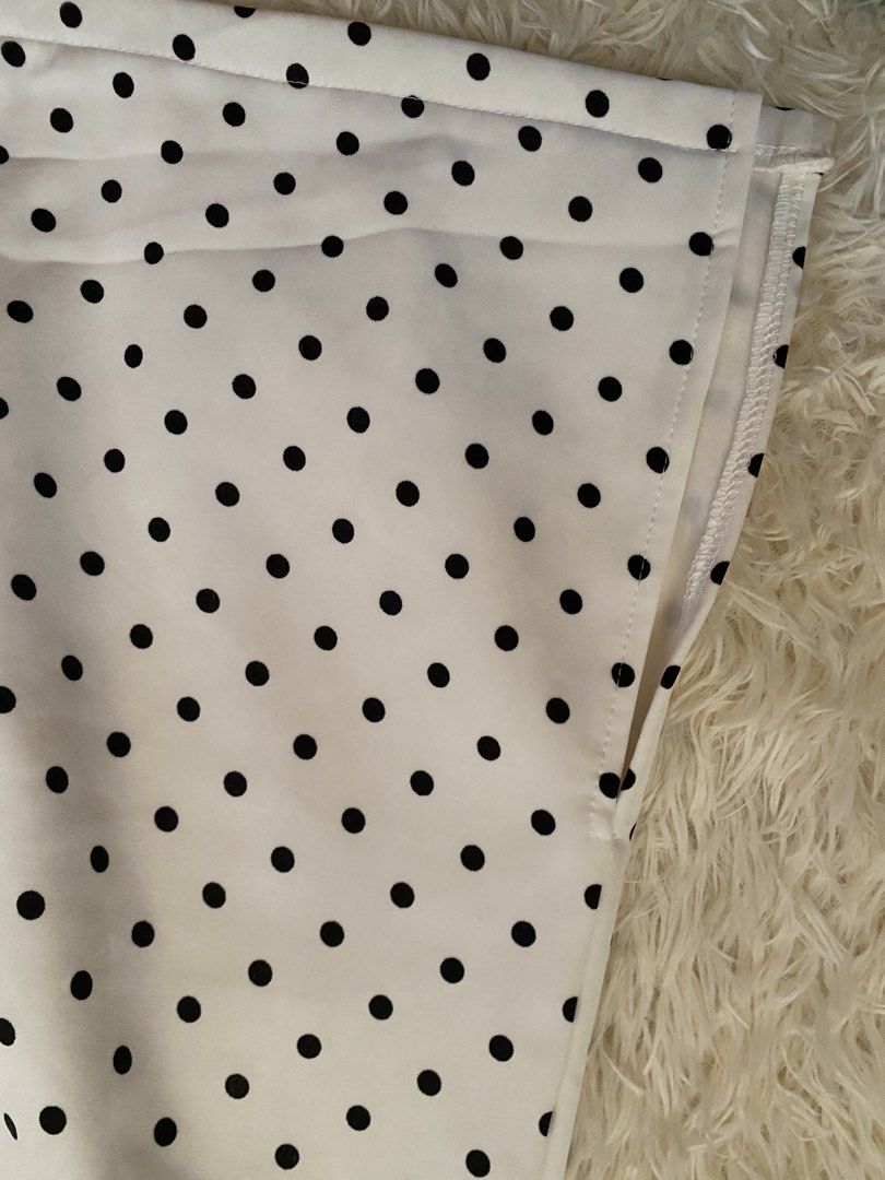 White and Black Polka Dot Skirt (Category: Skirts) located in Guagua. Submitted by zenn_vi (Listing ID 1465273467, Image 3). Description: - Color & Pattern: White with all-over black polka dots - Waistband: Structured with clean stitching and finished edges - Versatility: Easily dresses up for the office or down for weekends - Wardrobe Staple: A classic, timeless piece that matches many tops.