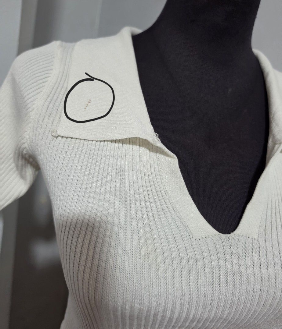 White Knitted Crop Top with Collar and Back Tie (Category: Blouses) located in Paranaque City. Submitted by franinnashop (Listing ID 1465310494, Image 3). Description: DECLUTTER SMALL TO MED PARANAQUE CITY - White ribbed knit crop top - V-neck collar with short sleeves - Back keyhole opening with tie-up ribbon detail - Stretchy and lightweight material - Flaw note: Small brownish spot on right collar and faint yellow stain on back tie strap.