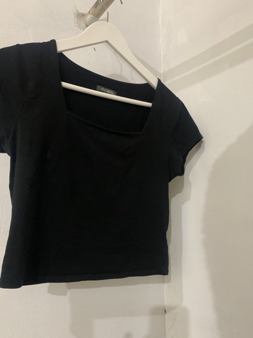 Wild Fable Black Square Neck Crop Top (Category: Sleeveless) located in Manila. Submitted by spaceshop12345 (Listing ID 1465216009, Image 2). Description: - Brand: Wild Fable - Color: Black - Size: S (Made in Guatemala) - Design: Square neckline with short sleeves - Material: Soft and comfortable fabric - Style: Versatile basic piece, perfect for pairing with high-waisted jeans or skirts for everyday casual wear.