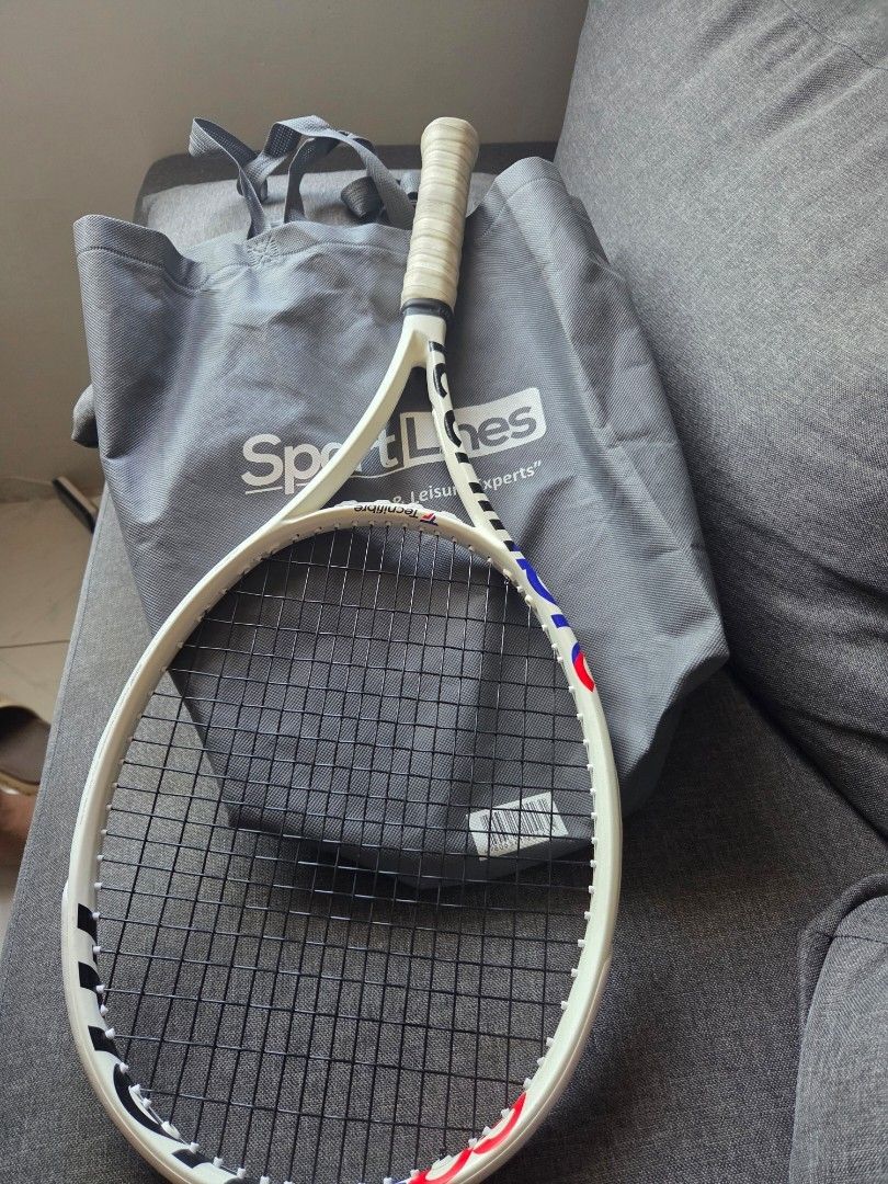 Wilson RSection Tennis Racket | Pre-owned | Vintage (Category: Racket and Ball Sports) located in Tagaytay City. Submitted by cluttersister (Listing ID 1465203418, Image 2). Description: Brand: Wilson Model/Series: RSection Color: White with red/blue accents Grip: Original-style replacement/overgrip installed Strings: Black strings, currently strung Frame: Used with normal signs of wear from storage/use No obvious major cracks or structural damag