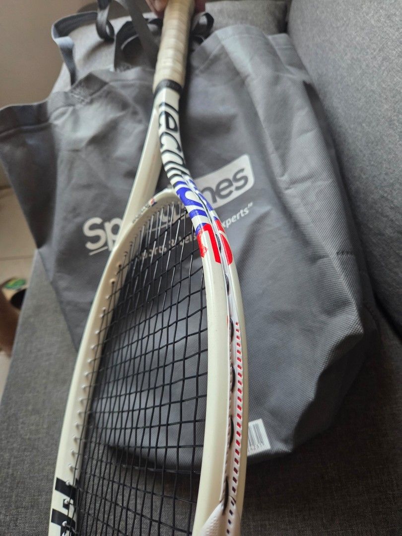 Wilson RSection Tennis Racket | Pre-owned | Vintage (Category: Racket and Ball Sports) located in Tagaytay City. Submitted by cluttersister (Listing ID 1465203418, Image 1). Description: Brand: Wilson Model/Series: RSection Color: White with red/blue accents Grip: Original-style replacement/overgrip installed Strings: Black strings, currently strung Frame: Used with normal signs of wear from storage/use No obvious major cracks or structural damag