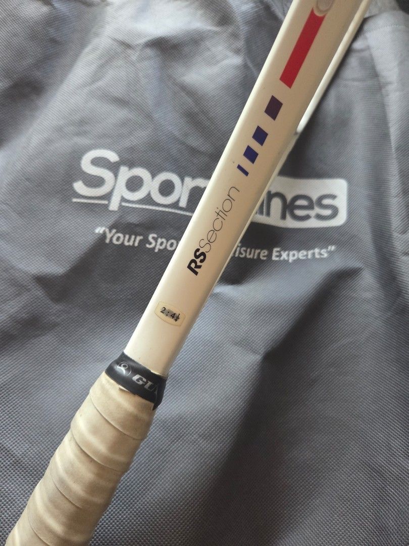 Wilson RSection Tennis Racket | Pre-owned | Vintage (Category: Racket and Ball Sports) located in Tagaytay City. Submitted by cluttersister (Listing ID 1465203418, Image 3). Description: Brand: Wilson Model/Series: RSection Color: White with red/blue accents Grip: Original-style replacement/overgrip installed Strings: Black strings, currently strung Frame: Used with normal signs of wear from storage/use No obvious major cracks or structural damag