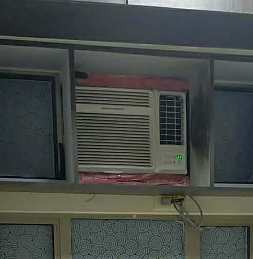 Window Air Conditioner Unit (Category: Air Conditioning and Heating) located in Manila. Submitted by delcastilloyel (Listing ID 1465178992, Image 1). Description: - Type: Standard white window air conditioner - 1hp and .75hp - Inverter - Display: Glowing green digital temperature readout with button controls - Airflow: Adjustable horizontal front louvers - Condition: Powers on properly, includes custom wooden cabinet slot - Inclusions: Standard p