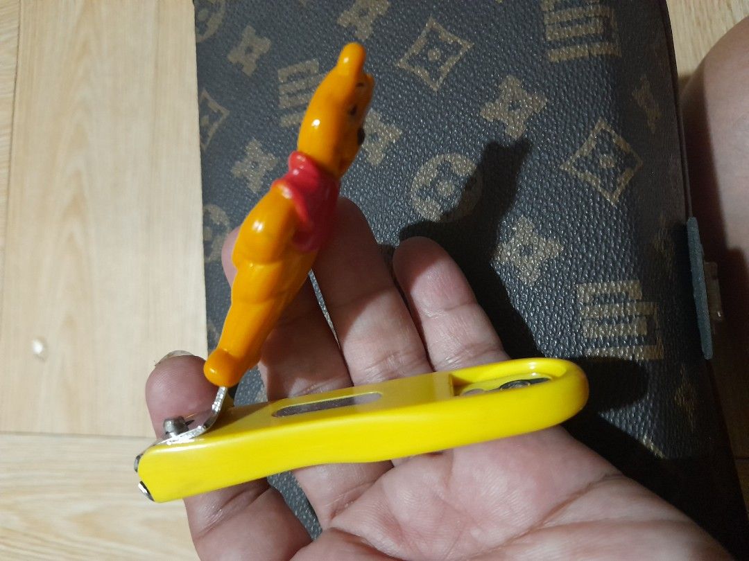 Winnie The Pooh Nail Cutter (Category: Hands & Nails) located in Bocaue. Submitted by marajapansurplus (Listing ID 1465293592, Image 2). Description: - Authentic Japan-sourced item - Cute Winnie The Pooh 3D character design in yellow and red - Compact and handy size for daily nail care - Sturdy stainless steel cutter with durable plastic casing.