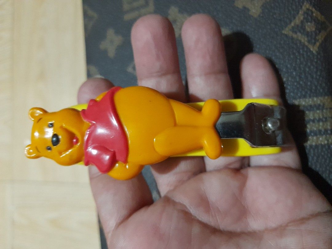 Winnie The Pooh Nail Cutter (Category: Hands & Nails) located in Bocaue. Submitted by marajapansurplus (Listing ID 1465293592, Image 3). Description: - Authentic Japan-sourced item - Cute Winnie The Pooh 3D character design in yellow and red - Compact and handy size for daily nail care - Sturdy stainless steel cutter with durable plastic casing.