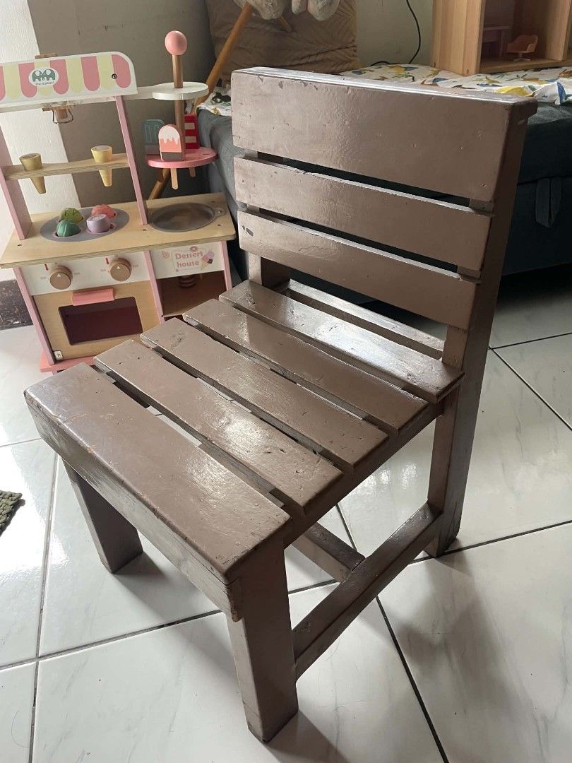 Wooden kids activity table and two chairs set (Category: Kids Tables & Chairs) located in Antipolo. Submitted by josephmangahas04 (Listing ID 1465189962, Image 3). Description: Decluttering our toddler's activity table and chairs set. Made from solid wood. The table has a laminated top kaya waterproof and easy to clean. As is with signs of usage. It needs cleaning and repainting but it is still very sturdy. The wood is thick and has a bit of weig