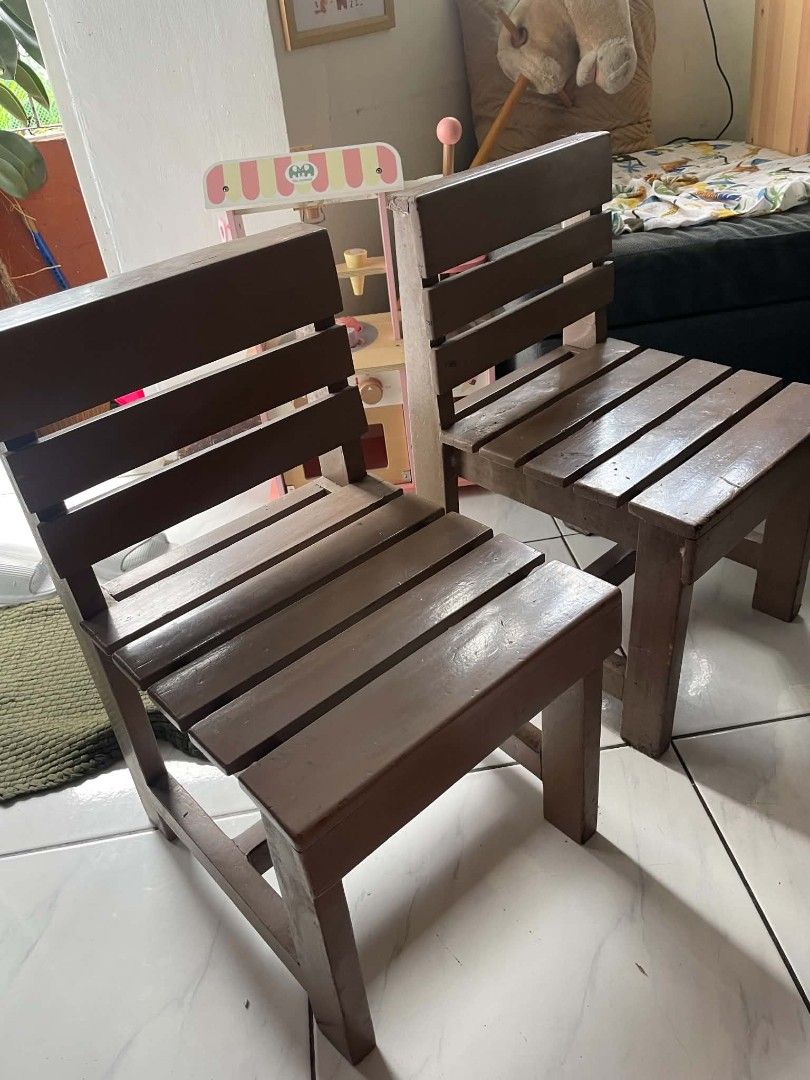 Wooden kids activity table and two chairs set (Category: Kids Tables & Chairs) located in Antipolo. Submitted by josephmangahas04 (Listing ID 1465189962, Image 2). Description: Decluttering our toddler's activity table and chairs set. Made from solid wood. The table has a laminated top kaya waterproof and easy to clean. As is with signs of usage. It needs cleaning and repainting but it is still very sturdy. The wood is thick and has a bit of weig