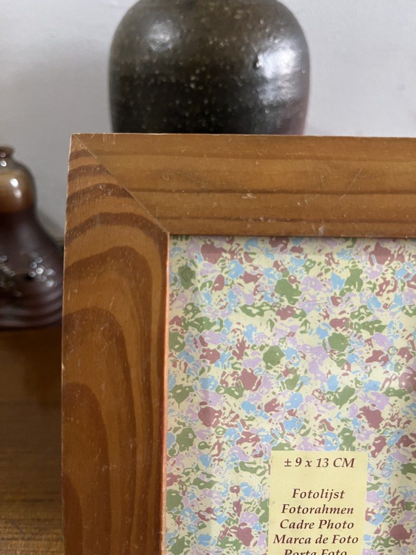 Wooden Picture Frame 9x13 cm (Category: Frames & Pictures) located in Taguig. Submitted by minmin_parker (Listing ID 1465293932, Image 2). Description: - Material: Sturdy wood with a clean natural finish and clear glass - Size: Fits 9 x 13 cm photos - Display: Built-in stand for easy tabletop use on desks or shelves - Design: Classic and versatile style that matches any home or office decor.