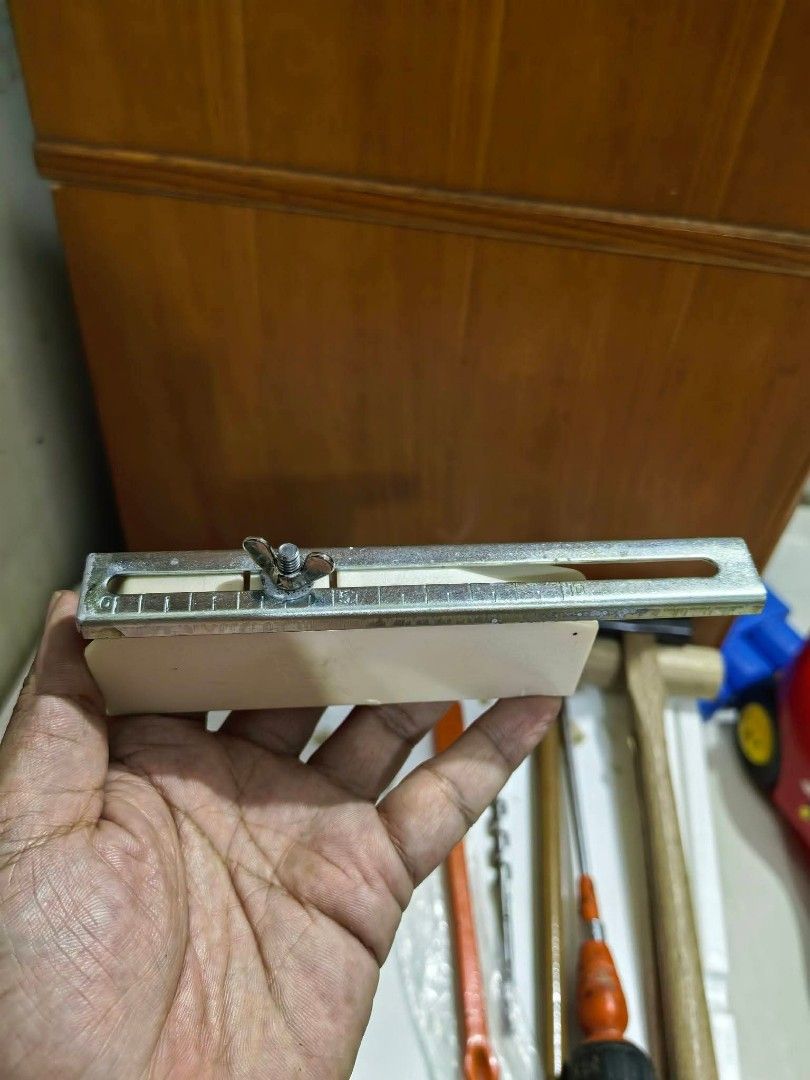 Workshop Wood Marking Gauge (Category: Home Improvement Tools & Accessories) located in Cebu City. Submitted by dudes_villanueva (Listing ID 1465176631, Image 3). Description: Workshop Wood Marking Gauge (often called a gramil in Spanish) 📌 Used in woodworking. 📌 Design: It features a slotted metal channel with an engraved measuring scale and a wing nut to lock the sliding fence or guide at a desired measurement. 📌 Function: Woodworkers use th