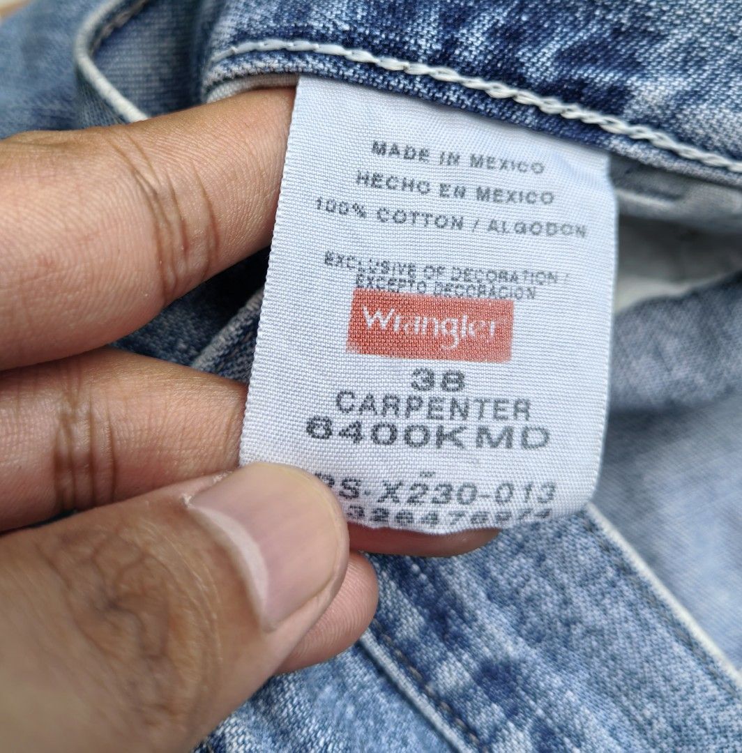 Wrangler Carpenter Denim Shorts Size 38 (Category: Shorts) located in Quezon. Submitted by miksxthrift (Listing ID 1465341802, Image 3). Description: - Brand: Wrangler - Style: Carpenter denim shorts - Color/Wash: Light wash blue - Size: Tagged 38 - Material: 100% cotton, Made in Mexico - Closure: Button fly - Features: Multiple utility pockets, left leg hammer loop, iconic woven back pocket label - Condition: Natural fraying and distressed spots