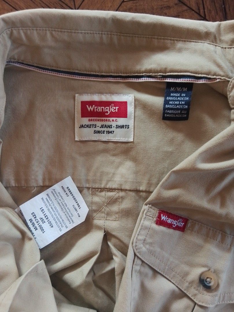 Wrangler •polo (Category: Tshirts & Polo Shirts ) located in Batangas. Submitted by 68.thrifts (Listing ID 1465233153, Image 2). Description: size: 23 x 30 / Medium on tag color: khaki or beige -like new -no issue -no pinhole -10/10 color rate.