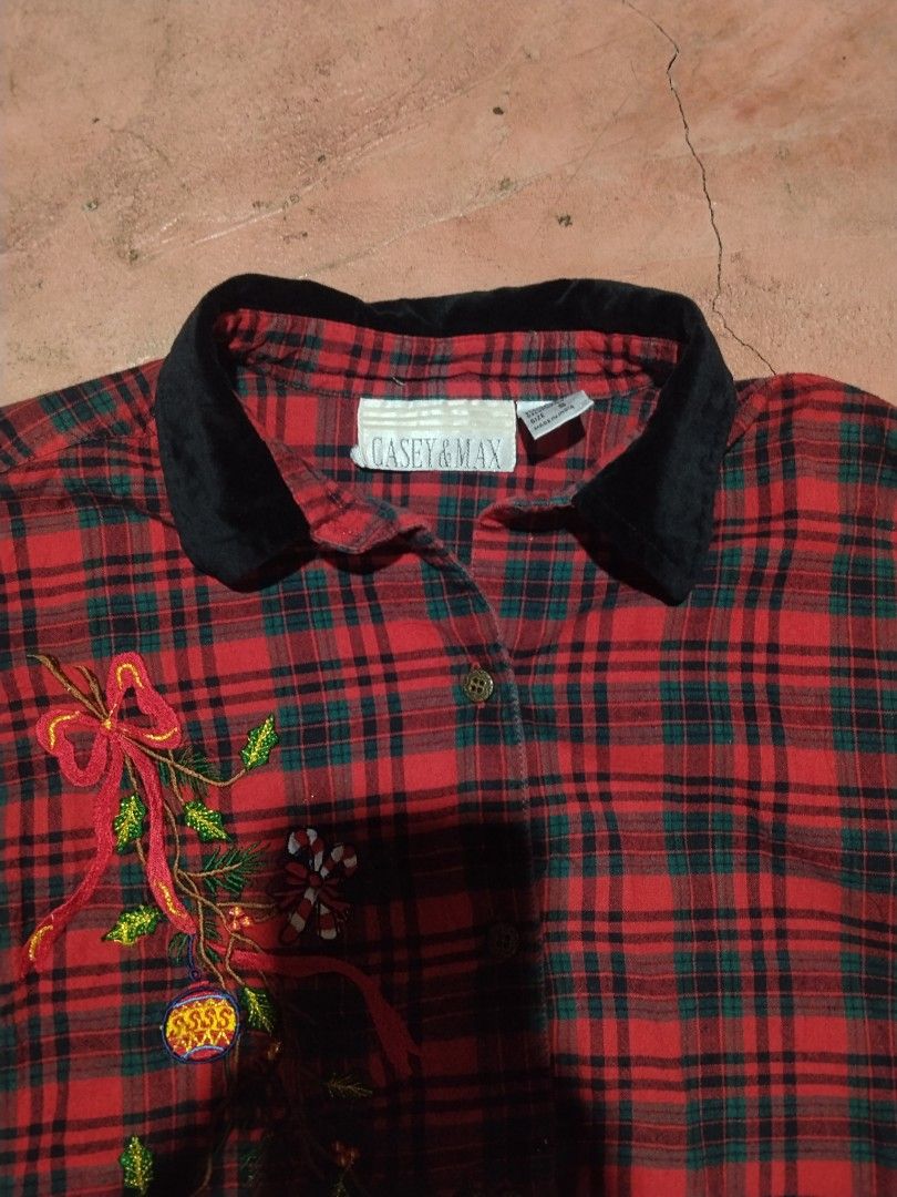 Y2k Casey & Max Christmas Plaid Long Sleeve Button-Down Shirt (Category: Longsleeves) located in Tagoloan. Submitted by trueocean.8cd0d0 (Listing ID 1465308534, Image 2). Description: - Brand: Casey & Max - Design: Red and green tartan plaid flannel with contrasting black velvet collar - Details: Festive embroidered holiday vines, ornaments, bows, candy canes, snowflake, stocking, and gift boxes across the front - Closure: Button-down front - Car
