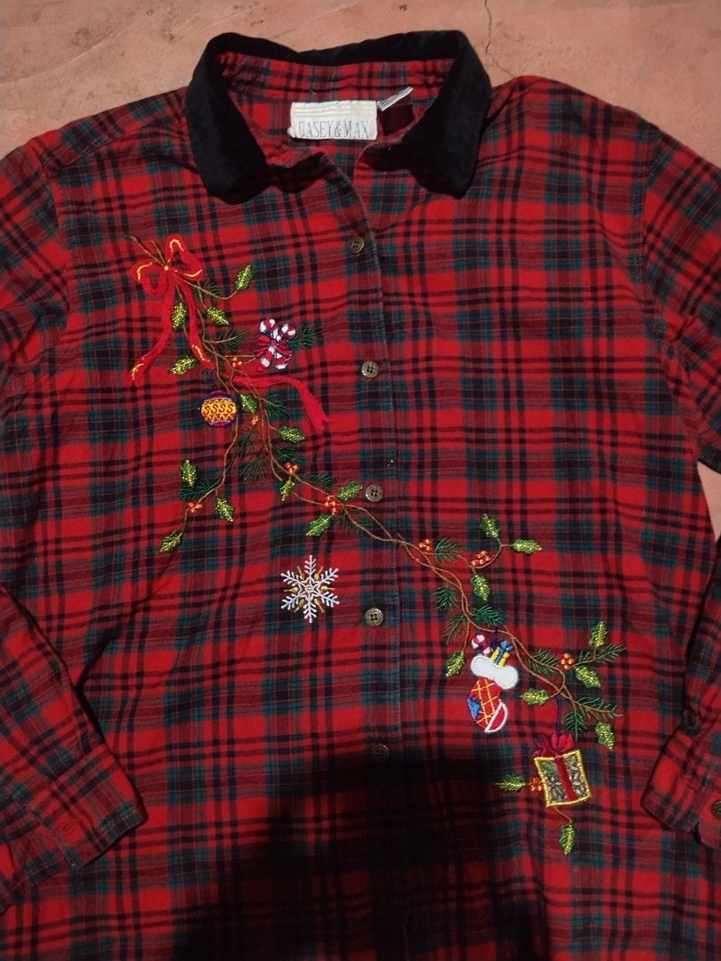 Y2k Casey & Max Christmas Plaid Long Sleeve Button-Down Shirt (Category: Longsleeves) located in Tagoloan. Submitted by trueocean.8cd0d0 (Listing ID 1465308534, Image 3). Description: - Brand: Casey & Max - Design: Red and green tartan plaid flannel with contrasting black velvet collar - Details: Festive embroidered holiday vines, ornaments, bows, candy canes, snowflake, stocking, and gift boxes across the front - Closure: Button-down front - Car