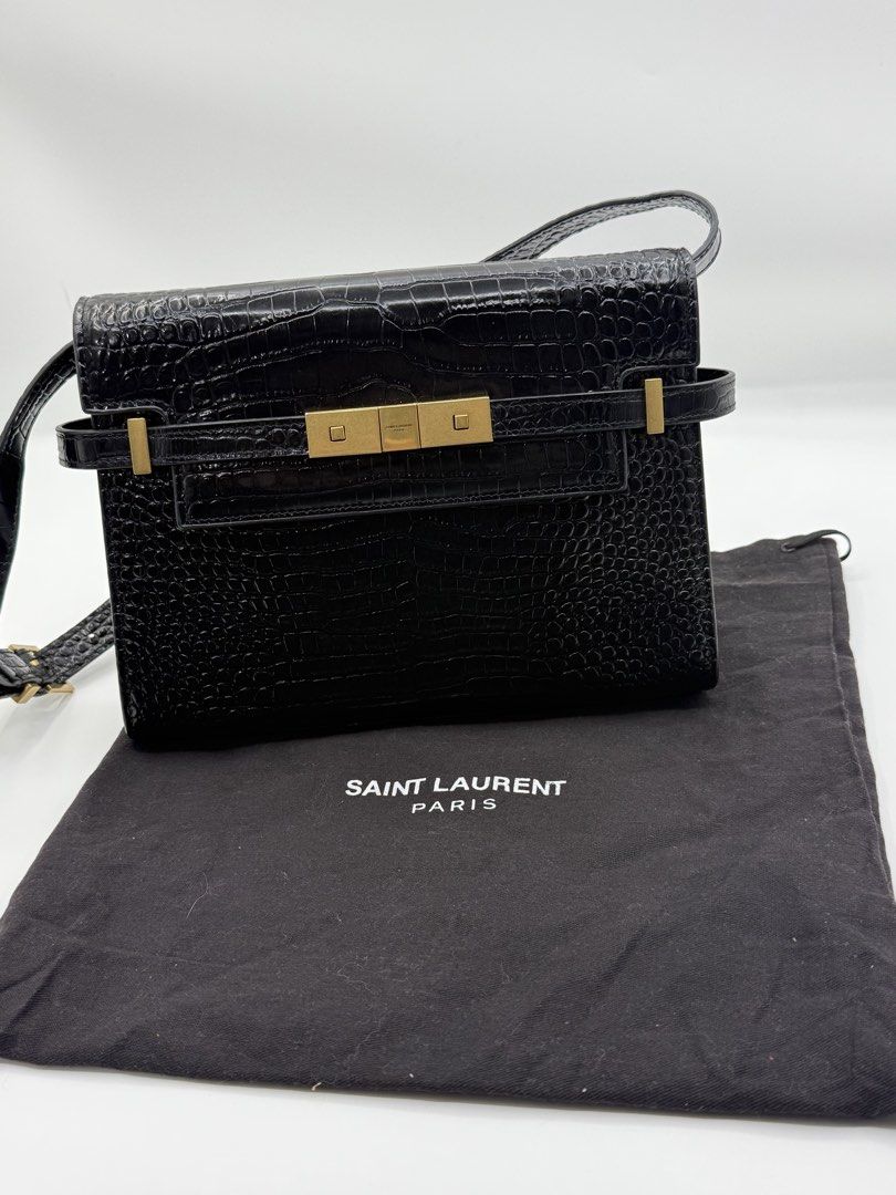 Ysl bag (Category: Shoulder Bags) located in Caloocan City. Submitted by rossvault2 (Listing ID 1465238227, Image 1). Description: - Brand: Yves Saint Laurent (YSL) - Color: Classic Black - Material: Premium crocodile-embossed leather - Hardware: Gold-tone metallic clasp with engraved Saint Laurent Paris logo - Style: Chic shoulder bag / crossbody - Condition: 7/10 (minor scratches on hardware, structure and leather well-maintained) - Inclusion: 