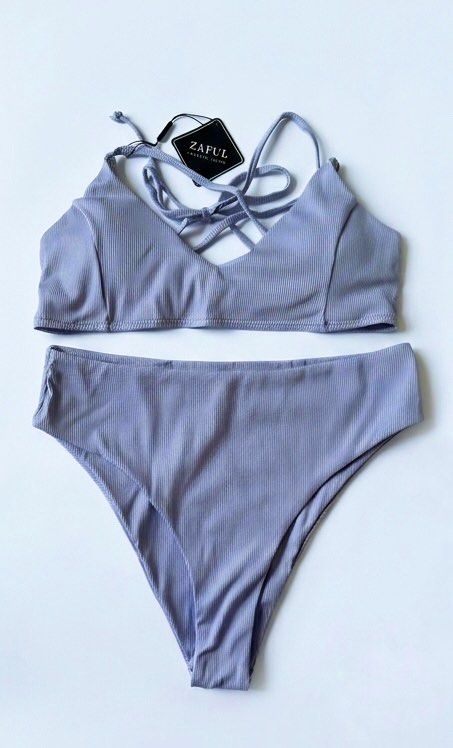 Zaful Ribbed High-Waisted Bikini Set Lavender (Category: Bikinis & Swimsuits) located in Manila. Submitted by ynaamo (Listing ID 1465263152, Image 1). Description: Brand new Zaful ribbed lavender two-piece swimsuit with original tags. Features a trendy high-waisted, high-cut bottom and a matching bralette top with stylish criss-cross straps..