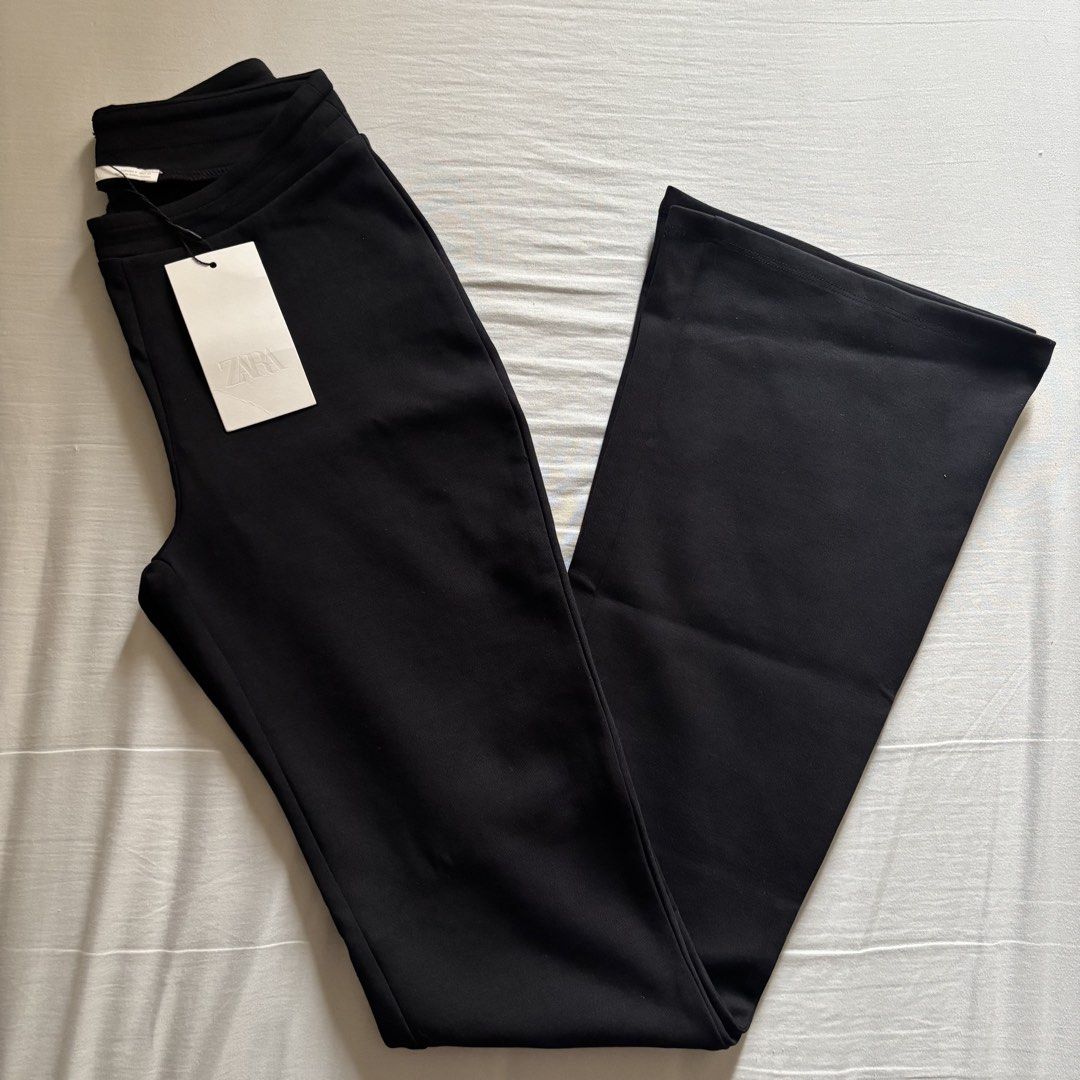 Zara Black Flared Pants - BNWT (Category: Jeans) located in Manila. Submitted by kndsccart (Listing ID 1465204224, Image 2). Description: Brand new Zara black flared trousers with tags, never worn size small - waist: 66 cm, hips: 94 cm High-waisted trousers made of thick, soft, and opaque stretch jersey. Elastic waistband. Flared legs. Material: 75% COTTON, 17% POLYESTER, 8% ELASTANE.