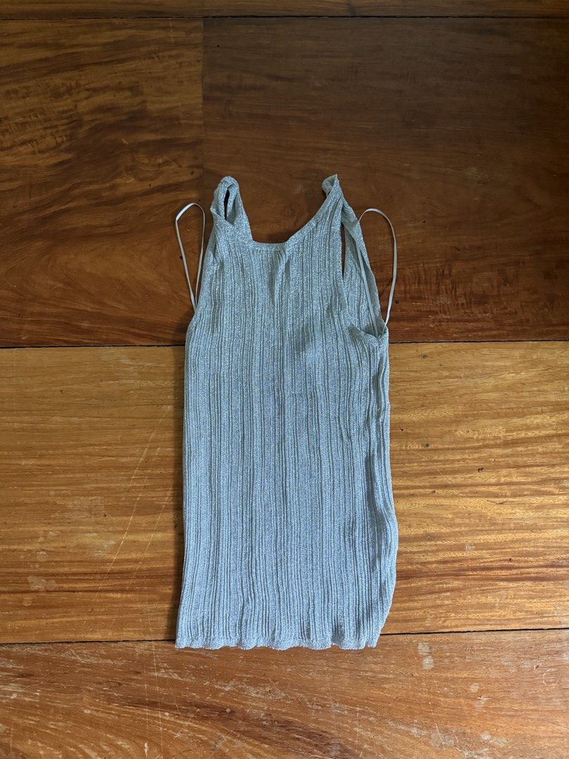 Zara Metallic Silver Ribbed Tank Top Size M (Category: Sleeveless) located in Manila. Submitted by boldcloset (Listing ID 1465220048, Image 1). Description: - Style: Metallic silver ribbed tank top with low U-back - stretchy material ! - Size: M - Condition: Good, with a small flaw (see photo) never been used, bought with minor flaw RFS: wrong size .