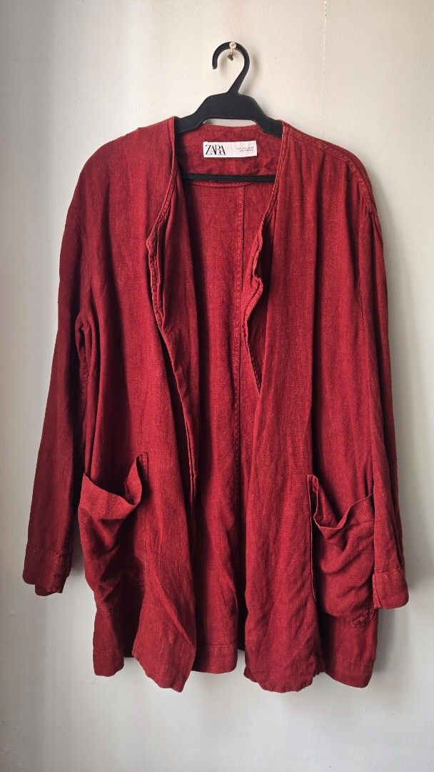 Zara Red Linen Cardigan (Category: Coats, Jackets and Outerwear) located in Manila. Submitted by gratsimaravilla (Listing ID 1465189006, Image 1). Description: - Brand: Zara - Style: Open front cardigan - Color: Rich dark red - Size: S (Made in Morocco) - Fit: Relaxed fit with long sleeves - Material: Lightweight and comfortable - Condition: Great layering piece for casual or evening wear.