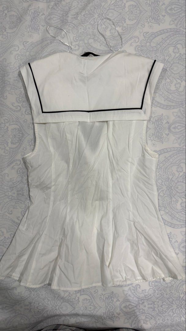 Zara Sailor Collar Black Tie White Blouse (Category: Blouses) located in Davao. Submitted by tswizzleeess (Listing ID 1465156568, Image 3). Description: Zara Sleeveless top with sailor collar and black tie closure Fits XS to Small Brand new with original tags attached, never worn. Message me for detailed photos if you want! ☺️ RFS: Decluttering 📍Davao City 💳 GCash, Bank Transfer (BDO) 📦 LBC, J&T SF shouldered by the buyer 😊.