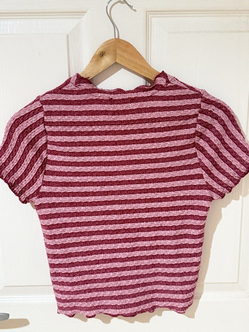 Zara Striped Ruffle Button-Front Top (Category: Blouses) located in Manila. Submitted by ktyyycloset (Listing ID 1465305764, Image 3). Description: - Brand: Zara - Condition: Brand new with tags (BNWT) - Size: Medium (true to size) - Color/Pattern: Red and pink stripes - Material: Textured knit fabric with great stretch - Details: Short sleeves, lettuce hem, plunging V-neckline, decorative front buttons - Original Retail Price: 1395 PHP - Style: 