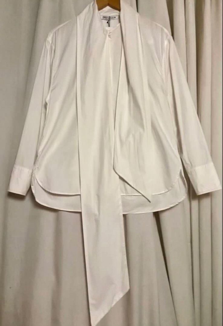 ZARA White Poplin Bow Tie Neck Longsleeve (Category: Shirts) located in Caloocan City. Submitted by declutteringph. (Listing ID 1465331444, Image 2). Description: Size S on the tag! Measurements: Dimension (inches) flat laid Shoulder- 19” Pit to pit - 21” Length - 26” - 29” Sleeves Length-22” .