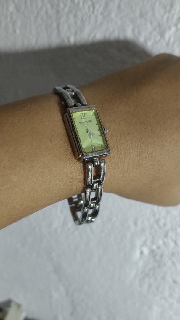 25 ans CLUB Paris Rectangular Dial Watch (Category: Women's Watches) located in Taguig. Submitted by mercyeugen28914 (Listing ID 1467023601, Image 3). Description: 25 ans CLUB Paris ladies wristwatch. Rectangular silver-tone case with a unique light green dial. Numbers 12 and 6 with dot hour markers. Link bracelet strap with clasp closure. Water-resistant base metal bezel with a stainless steel back. Assembled in Hong Kong. Stylish everyday acces