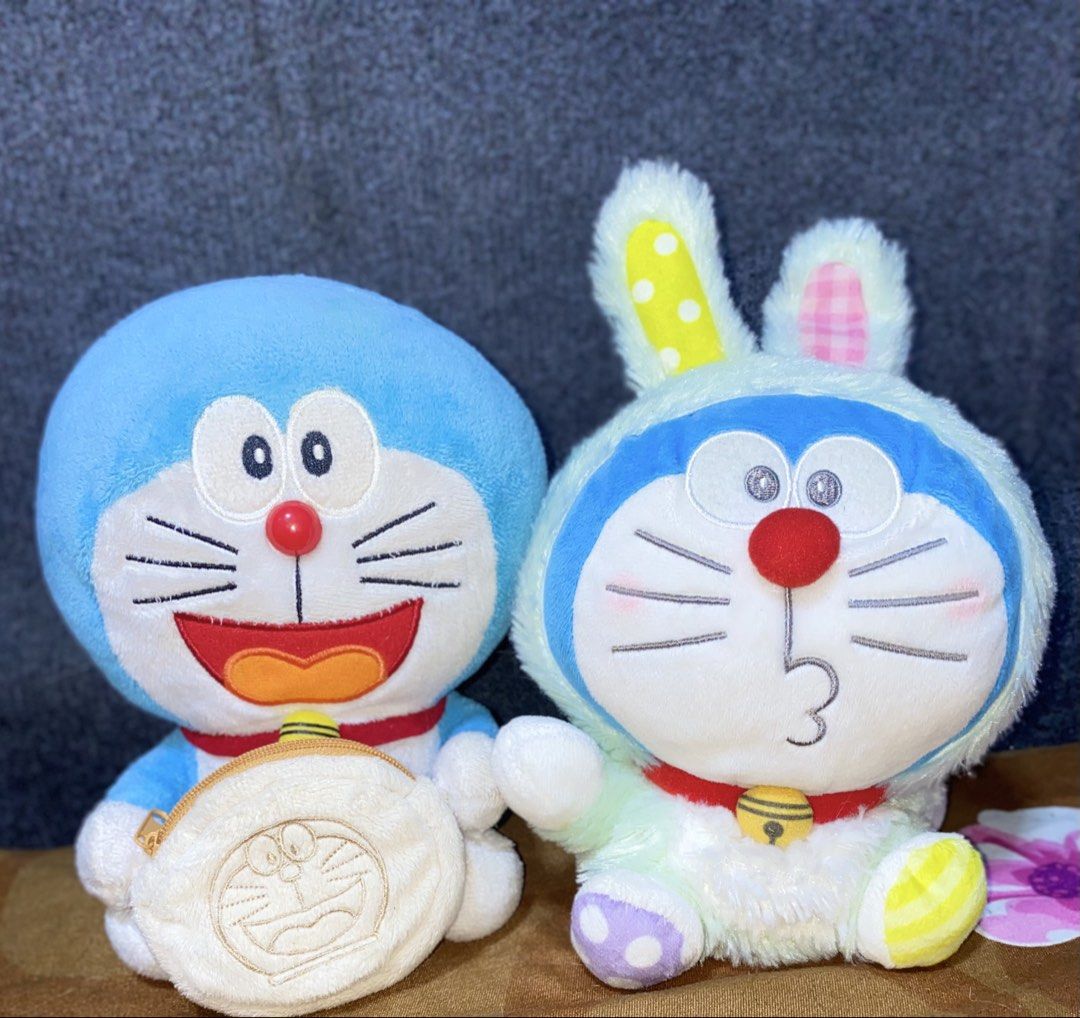 2pcs Doraemon Bundle Mascot Size Plush (Category: Plushies & Soft Toys) located in Los Banos. Submitted by chus.things (Listing ID 1467156343, Image 2). Description: Welcome to Chus Things! Help me declutter by buying my some of my collections/stuffs. Tyia! Selling 2pcs Doraemon Mascot M Plush Both with readable plush tag; no paper tags 1. Doraemon in Pastel Green Easter Bunny Costume 2. Doraemon holding dorayaki coin purse (functional can keep s