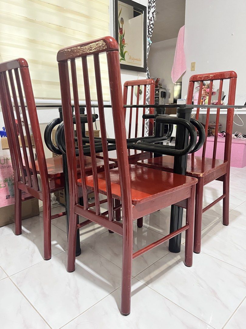 4-seater Dining Set (Category: Tables & Sets) located in Manila. Submitted by britz.wealth (Listing ID 1467021721, Image 2). Description: 1 rectangular glass top with steel legs- with small chip under 4 wood chairs- needs repainting Location: Project 8, Quezon City.