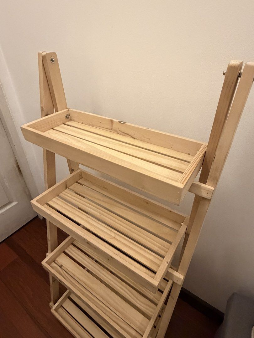 4-Tier Wooden Rack / Display Shelf (Category: Other Home Furniture) located in Mandaluyong City. Submitted by meowwth (Listing ID 1467091872, Image 3). Description: Selling my wooden 4-tier rack in very good condition! * No issues; well-maintained * not being used anymore Dimensions: * Height: 45 inches * Width: 21.5 inches * Depth: 13 inches Price: ₱1,200, negotiable. Buyer may arrange pickup or delivery at their expense. Message me if intereste