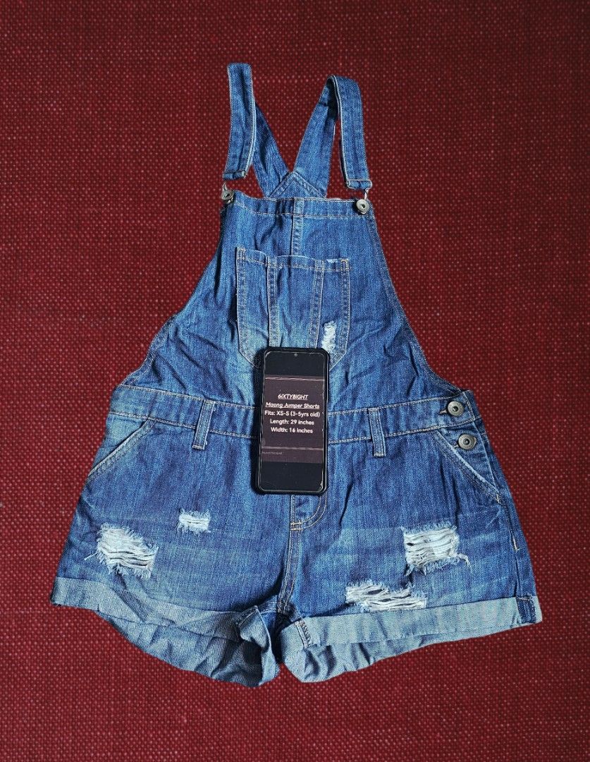 6ixty8ight Maong Jumper Shorts (Category: Shorts) located in Marikina City. Submitted by anbierose (Listing ID 1467007385, Image 1). Description: - Brand: 6ixty8ight - Item: Distressed denim romper - Size: Fits kids 3 to 5 years old - Measurements: 29 inches (length) x 16 inches (width) - Details: Classic blue wash, intentional front rips, cute front chest pocket, rolled-up hem cuffs - Condition: Great casual piece for everyday outings.