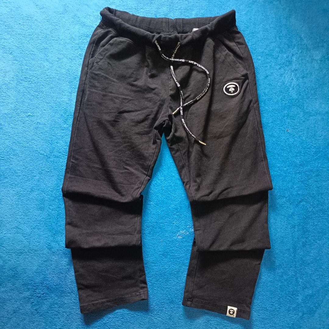A Bathing Ape BAPE Black Sweatpants Drawstring Joggers (Category: Joggers) located in Antipolo. Submitted by juliane_thrift-declutters (Listing ID 1467083201, Image 1). Description: Aape Black Jogger Pants Size: 28 inches (Adjustable) Length: 32 inches Thigh: 16 inches Leg Opening: 11 inches Embroidered Logo Issue: None Tags: Complete Wash Tags Overall Condition: 8.9/10 * Color may vary due to lighting.