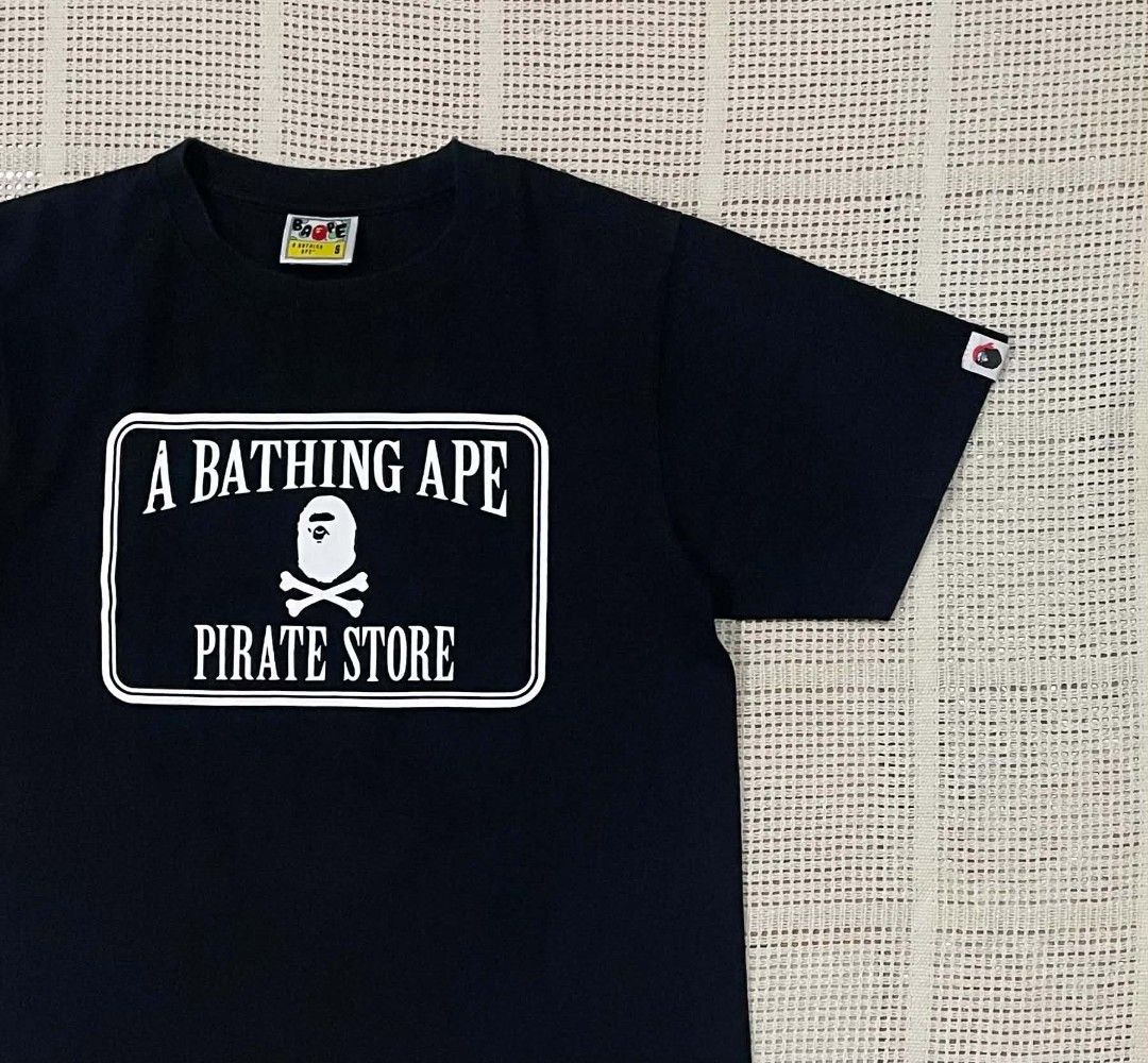 A Bathing Ape Pirate Store Crossbone Tee (Category: Luxury Apparel) located in Bacolod City. Submitted by abkicks_apparel (Listing ID 1467131235, Image 3). Description: A Bathing Ape Pirate Store Crossbone Tee Small on Tag W19 L26 Authentic Original Excellent Condition No Hidden Issues .