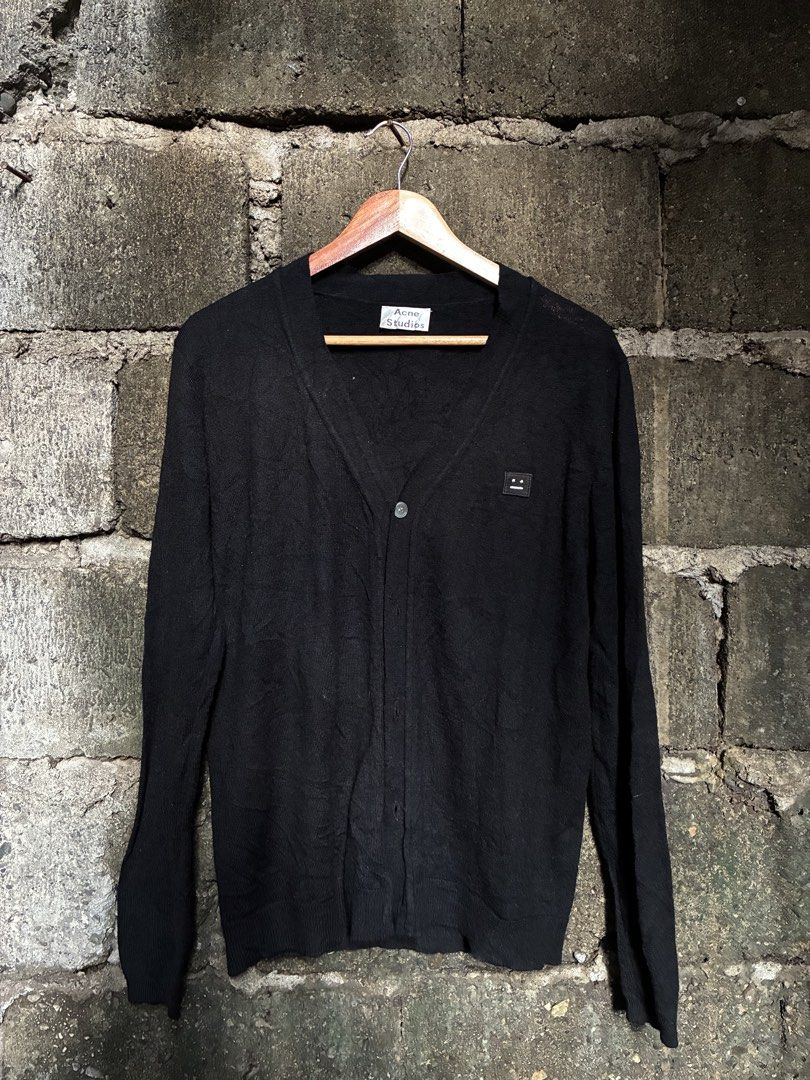 Acne Studios College Face Wool Cardigan Black (Category: Longsleeves) located in Manila. Submitted by assortedgoodsv3 (Listing ID 1467165741, Image 1). Description: - Brand: Acne Studios - Item: Black wool cardigan - Size: Large (L) - Material: 100% wool knit (lightweight & warm) - Design: V-neck, front button closure, ribbed cuffs & hem - Detail: Signature face logo patch on the left chest - Condition: Clean, tags intact.