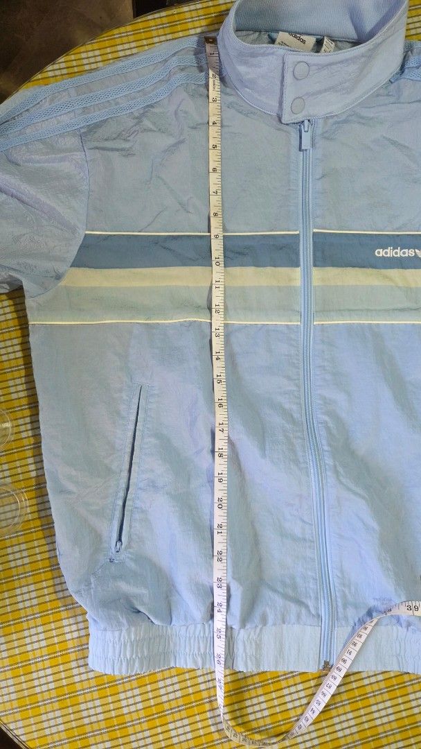 Adidas 80's Nylon Archive Track Top (Category: Coats, Jackets and Outerwear) located in Cainta. Submitted by DBdibs (Listing ID 1466989159, Image 3). Description: Make reading a habit. Adidas Originals Nylon Track Top SRP = 5,000 selling for 3,000 Width = 24" (check photo) Length = 26" (check photo) ‣ color may vary due to lighting conditions. check last few photos for Adidas website reference ‣ Like new, never been used. Sinukat lang. Stored sa 