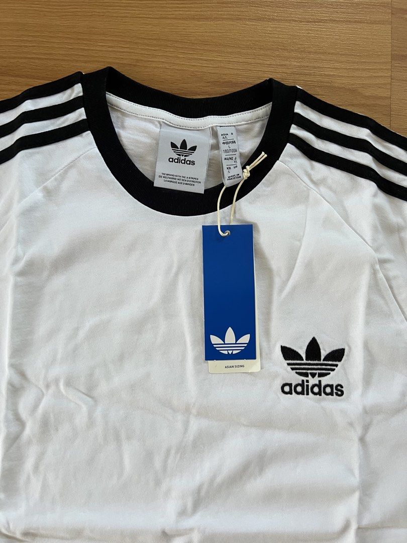Adidas Adicolor Classics 3-Stripes Tee Shirt (Category: Tshirts & Polo Shirts ) located in Muntinlupa City. Submitted by abbysantosss (Listing ID 1467001006, Image 3). Description: Classic fit, super comfortable cotton fabric Brand new, never worn, with original store tag.