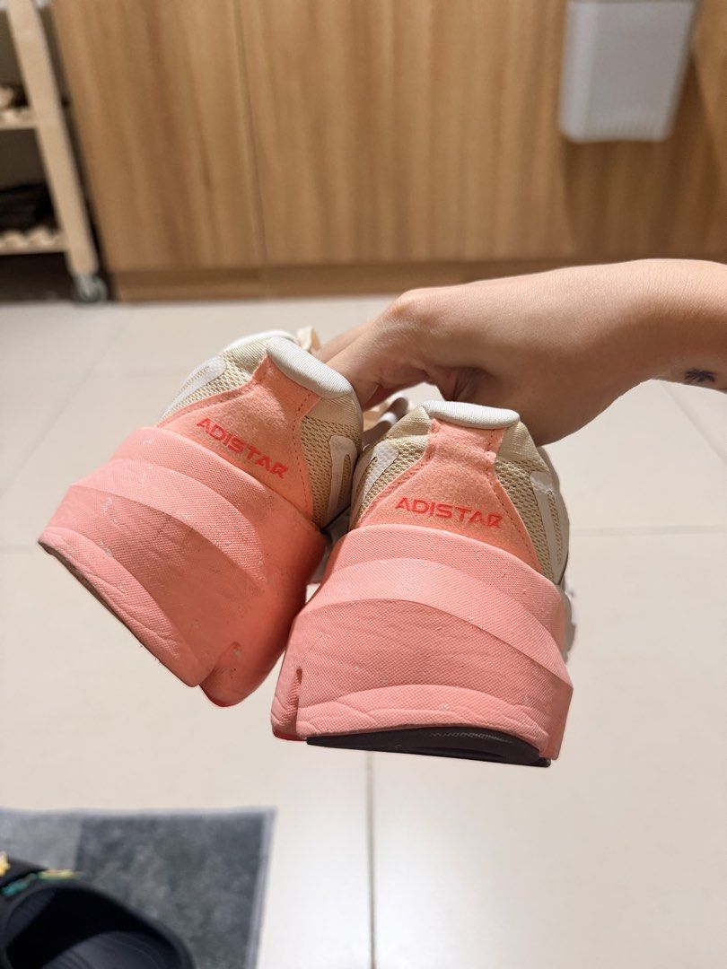 Adidas Adistar (Category: Sneakers) located in Mandaluyong City. Submitted by mntssapdrns (Listing ID 1467115011, Image 3). Description: - Brand: Adidas - Model: Adistar - Color: Beige with pink and silver accents - Features: Thick Repetitor midsole cushioning, durable Continental rubber outsole - Condition: Pre-loved, well-maintained - black rubber sole is missing (I removed it since natanggal na yung dikit but it doesn’t affect the performance)