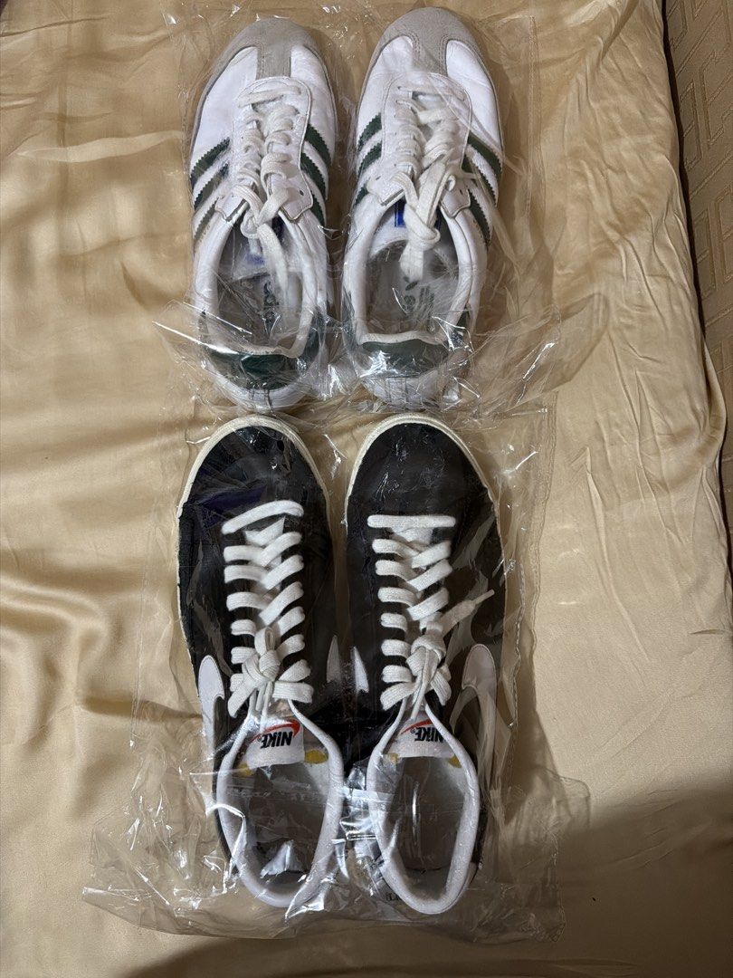 Adidas and Nike Sneakers Bundle (Category: Sneakers) located in Cabuyao City. Submitted by crmnmlvn34389 (Listing ID 1467135914, Image 1). Description: - Sneaker bundle: 2 classic everyday pairs - Pair 1: White Adidas with green stripes and suede toe detail - Pair 2: Black Nike with white swoosh and laces - Condition: Both kept inside protective plastic packaging - Perfect addition to any shoe rotation.