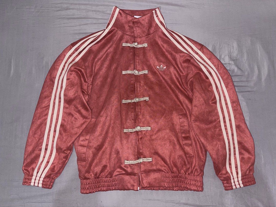 Adidas Chinese Tang Track Jacket Red (Category: Coats, Jackets and Outerwear) located in Cebu City. Submitted by meemaoo (Listing ID 1467148924, Image 1). Description: - Brand: Adidas - Bought when I was at China - Style: Red velvet track jacket with stand collar - Unique Details: Chinese knot toggle buttons instead of a zip - Branding: Embroidered trefoil logo on the chest and classic three stripes down the sleeves - Finish: Ribbed hem and cuffs