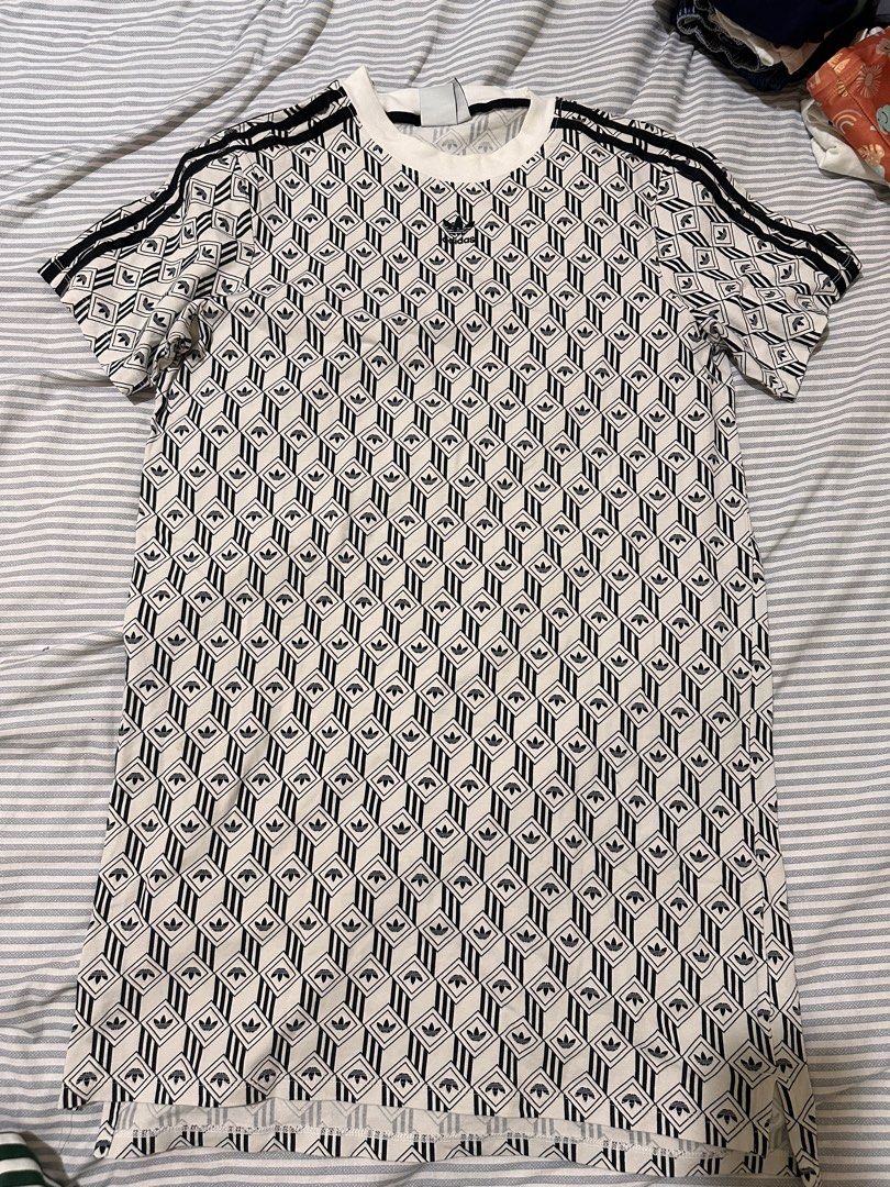 Adidas geometric pattern Dress US S (Category: Shirts) located in Taguig. Submitted by impulsivebuyer0225 (Listing ID 1467084686, Image 1). Description: - Design: Black and white geometric trefoil pattern with signature 3-stripes on short sleeves - Fit & Size: US S, UK 10, D 36 (Classic ribbed crewneck) - Material: Lightweight and breathable cotton blend - Condition: Clean overall, no obvious flaws - Origin: Made in China.