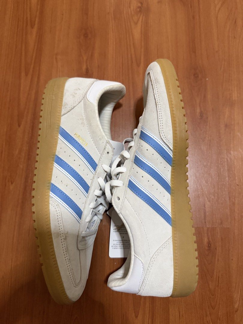 Adidas Hand 2 White Blue Sneakers (Category: Sneakers) located in Batangas. Submitted by bullet909 (Listing ID 1467134943, Image 2). Description: - Brand: Adidas - Model: Hand 2 - Colorway: White with light blue stripes and gum soles - Size: UK 10.5 / US 11 - Condition: Brand new with original store tag attached - Features: Classic low-top design, premium suede texture, and contrast tongue branding - Mode of transaction: Shipping or meet-ups avai