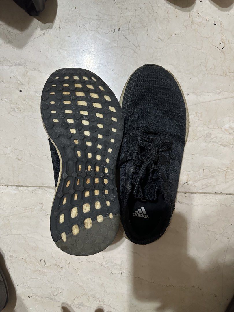 Adidas Pureboost Black Running Shoes (Category: Sneakers) located in Manila. Submitted by bobberbob797701 (Listing ID 1467030320, Image 2). Description: - Brand: Adidas Pureboost - Color: All Black with White Boost midsole - Upper: Breathable knit material with matching black laces - US 3 1/2 - Condition: Used, with some wear and dirt on the midsole; rubber outsole still has great traction - Features: Signature Adidas logo on insole - Best for: E